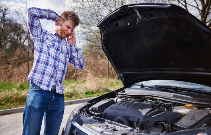 man-having-problem-with-his-car_329181-11882